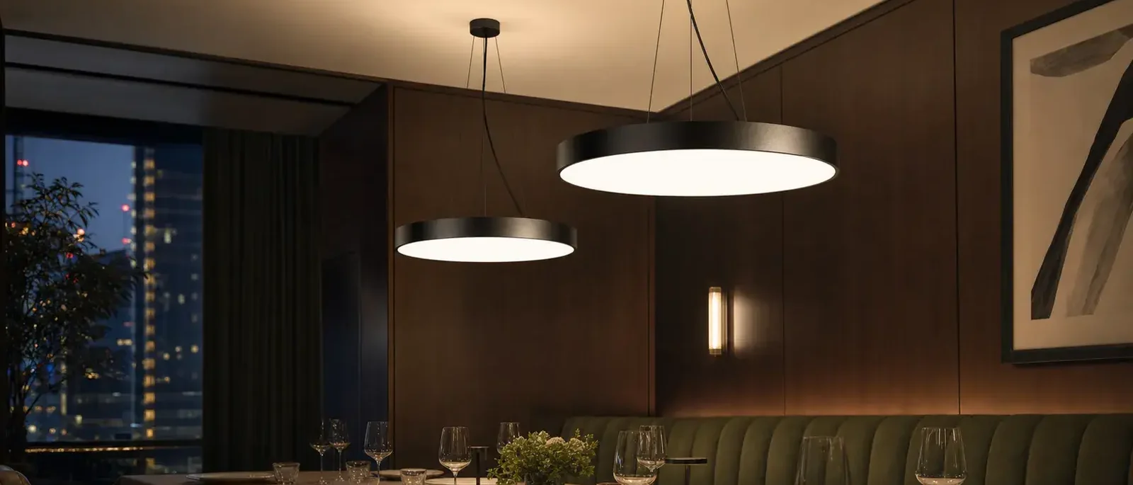 Suspended direct/indirect pendant lighting in a hospitality space