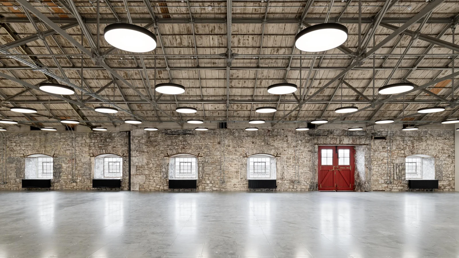 Suspended lighting for exposed concrete and industrial ceilings